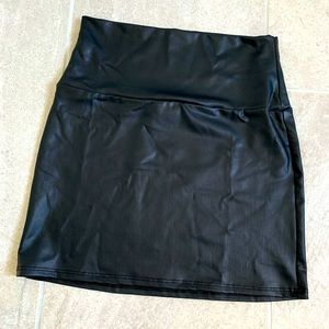 Faux leather mini skirt size small.